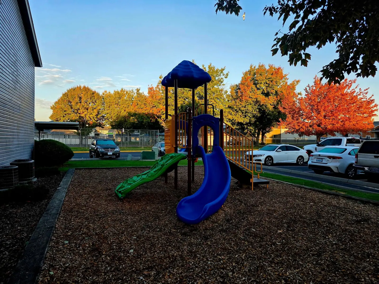 Apartment playground with autumn trees