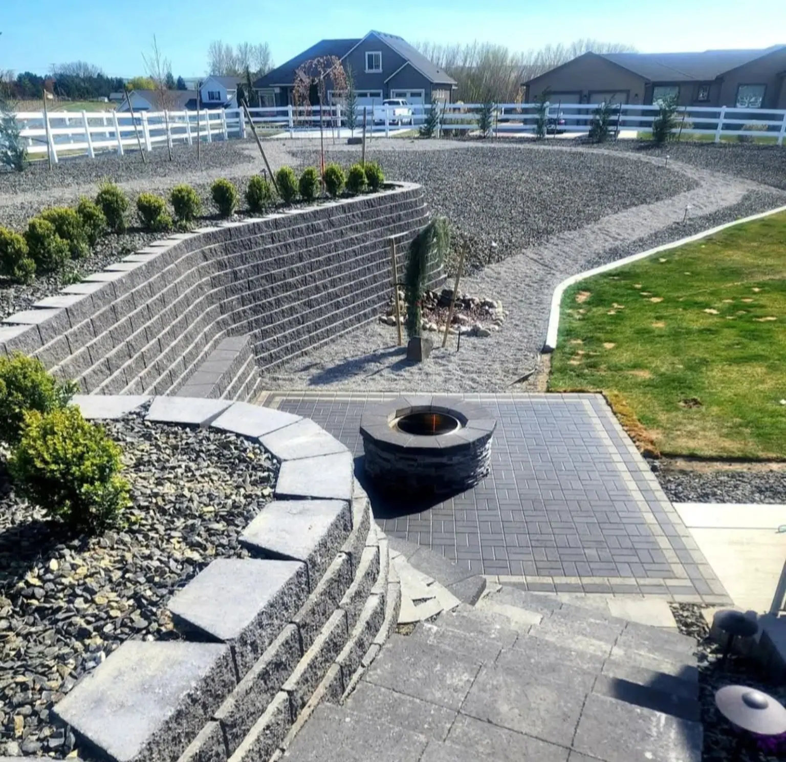 Terraced block wall with paver fire pit area